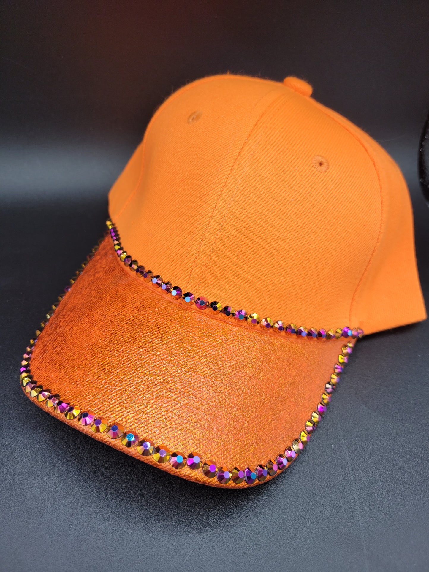 Orange dad cap with bronze foil and purple rhinestones